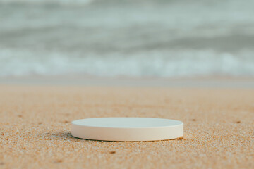 Fototapeta na wymiar Empty round white platform podium on beach sand background.