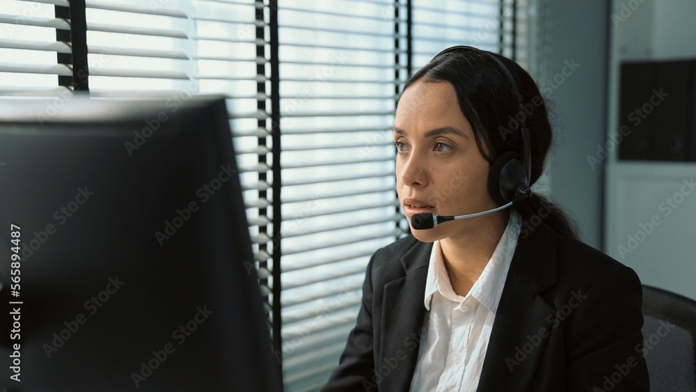 Poster competent female operator working on computer and talking with clients. concept relevant to both cal