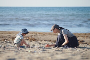 parent and child on beach