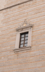 old window on a brick wall