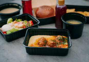 Street food. Meat cutlet burgers are in paper boxes. Food delivery.