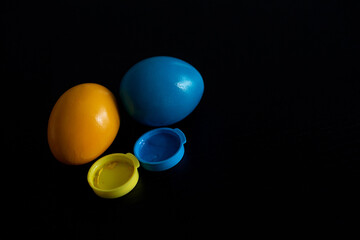 Easter eggs in blue and yellow colors of the flag of Ukraine. Stop war in Ukraine concept.