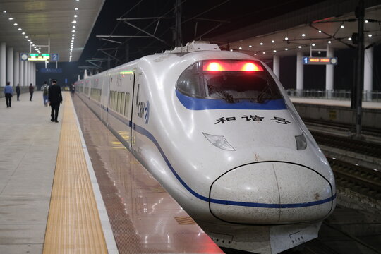 Shanghai,China-Oct.22nd 2022: Hexie (Harmony) CRH series EMU train at railway station platform at night. China Railway High-speed train
