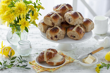 Beautiful spring table with Traditional Easter hot cross buns