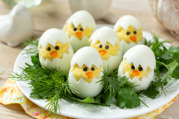 Funny stuffed eggs chicks. Easter idea for breakfast - 565899220