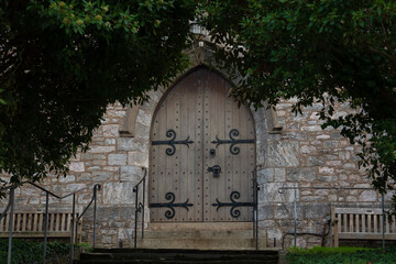 Beautiful old wooden castle door with iron ornaments in a medieval castle