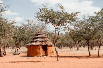 Closeup of traditional hut of himba tribes in Namibia, Africa. Tupical himbas people house from red clay and trees branches