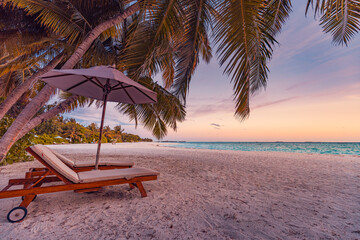 Amazing sunset beach. Romantic couple chairs umbrella. Tranquil togetherness love concept scenery,...