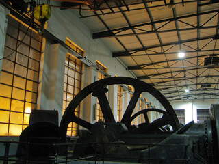 An old machine hall with large flywheels for power generation.