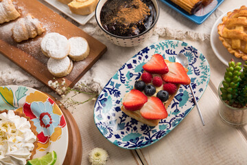 Strawberry and blueberry tartlet  Assorted peruvian desserts peru sweet food buffet table brunch