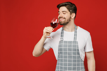Young smiling sommelier fun happy caucasian male housewife housekeeper chef cook baker man wear...