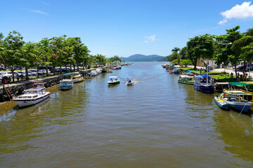 Boats crosses the river in Paraty, Brazil