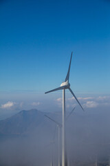 Fototapeta na wymiar Wind mills on the top of mountain