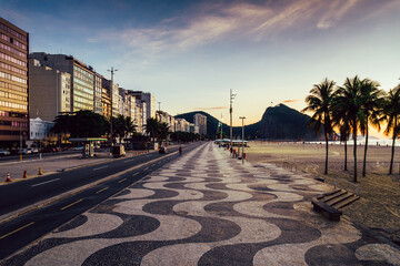 Empty wavy mosaic pattern of sidewalk in Leme, Copacabana, Rio de Janeiro, Brazil at sunrise