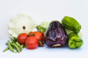 Heap of fresh vegetables on white background
