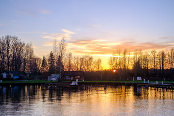 Naklejka premium sunset over the river
