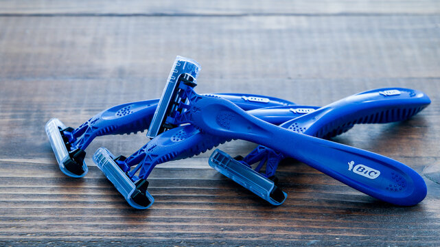NORWALK, CT, USA - JANUARY, 27, 2023: Shaving blades from Bic Comfort 3 with three blades on wooden background