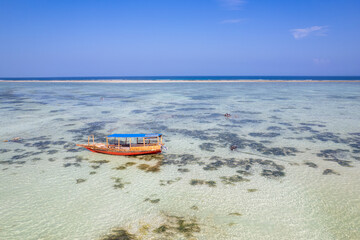 Fototapeta na wymiar Catamaran (Ngalawa) on amazing turquoise water in the Indian ocean next to Mnemba atoll, Zanzibar, Tanzania