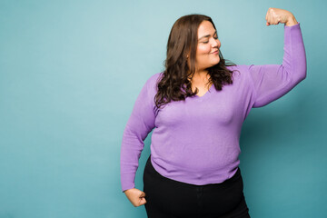Strong big woman doing a bicep curl