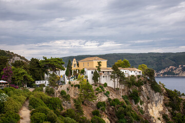 Fototapeta na wymiar Corfu, Greece. Courtyard of the Theotokos Monastery also known as Paleokastritsa Monastery.