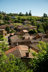 Fototapeta premium Wine making region Beaujolais Pierre dorees wioth yellow houses and hilly vineyards, aerial view, France