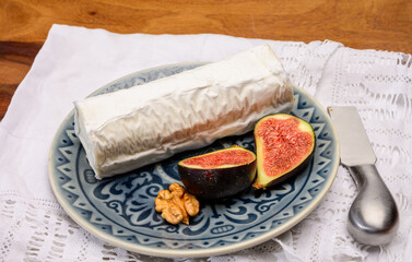 French organic matured white goat cheese with white rind close up