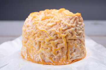French Langres soft cows crumbly cheese with washed rind structure made in Champagne - Ardenne region