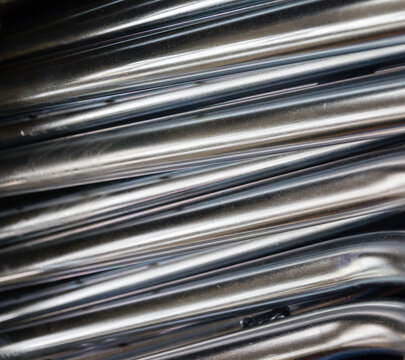 Close up of Exhaust Pipes. Industrial background. Galvanized metal tubes – Pipes with zinc plated coating. Abstract background view of steel light blue galvanized pipes. Construction metal pipes.