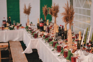 celebration table with food, drinks and decorations