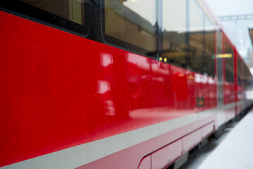Red swiss train of the albula express railway in winter