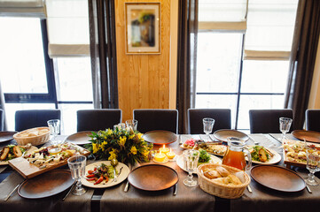 Beautifully served banquet table with flowers and candles