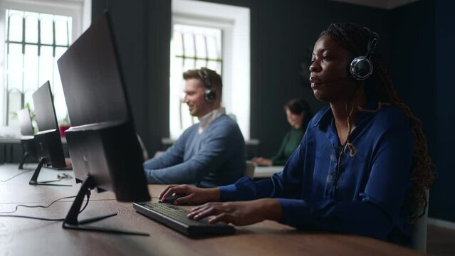call-center of big company, black woman tech specialist answering on customer questions