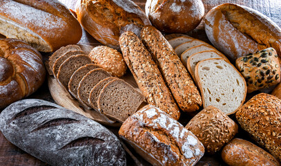 Assorted bakery products including loafs of bread and rolls