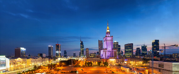 Evening cityscape with city lights, panorama, banner - view of the Warsaw downtown and The Palace of Culture and Science. Warsaw. Poland