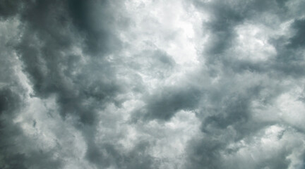 Dramatic sky background, thunderclouds in stormy weather, dark gray sky, moody natural cloudscape