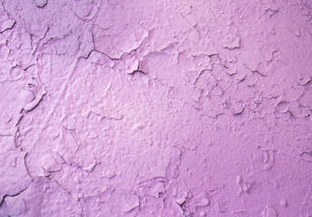 Abstract background. Closeup fragment of cracked and peeling painted wall.