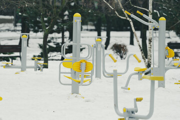 fitness equipment in the park during the winter