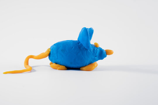 Blue Orange Hand Made Plasticine Play Dough Model Of A Mouse Isolated On A White Background