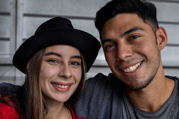 Portrait of two young Latin American brothers smiling in front of the camera. Concept of brotherhood and family