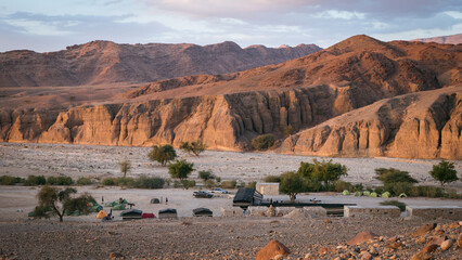 a camp in the Jordan landscape during sunset