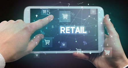 Close-up of a hand holding tablet with shopping inscription