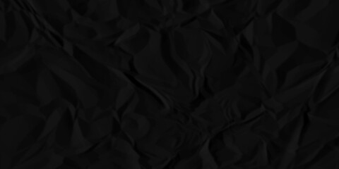 Black crumpled paper texture background. A crumpled sheet of dark gray paper abstract background.	
