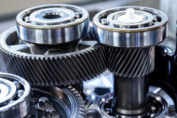 Gears of the main gear of the transmission of an electric vehicle. Transmission disassembled for...