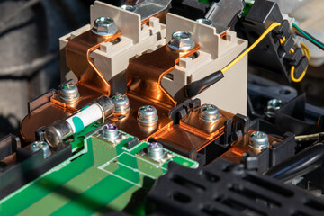Сlose-up view of the contactors that take part in the fast charging of an electric vehicle,...