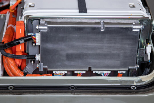 Close-up of lithium battery control unit and lithium battery inside an electric car, showcasing the technology behind sustainable transportation.