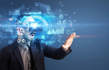 Businessman looking through VR glasses