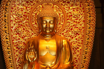 Fototapeta premium Close up Golden Buddha Statue in the Jade Buddha Temple
