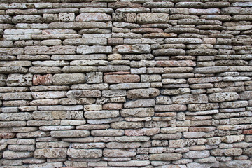 The wall is made of natural stone