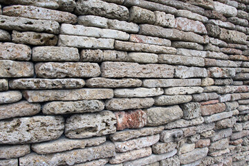 The wall is made of natural stone