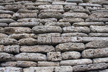 The wall is made of natural stone